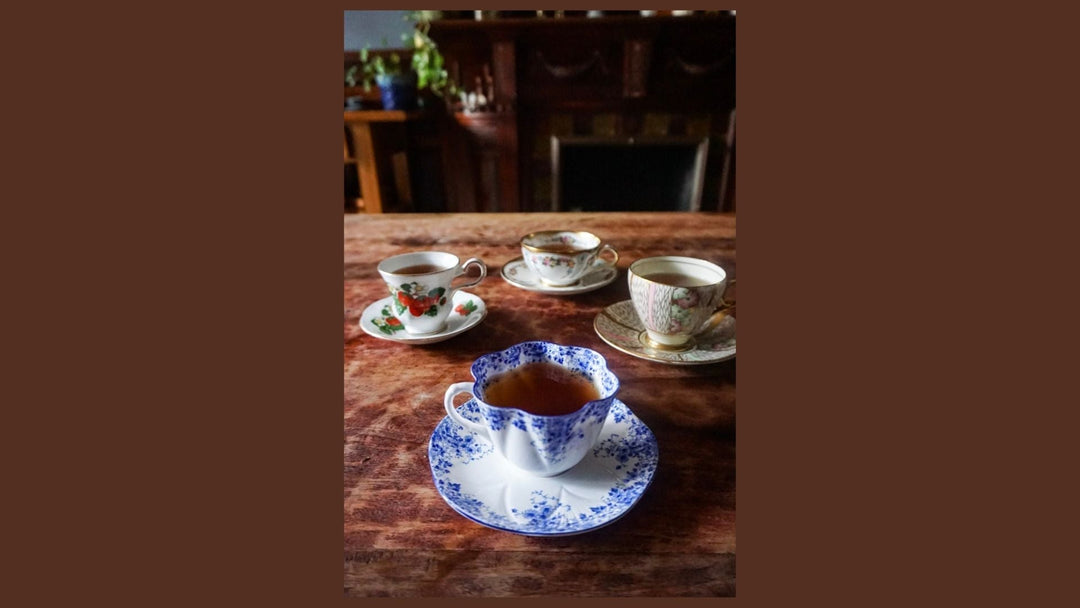 Premium organic Earl Grey loose leaf tea blend showing vibrant blue cornflower petals and fresh bergamot citrus slices.